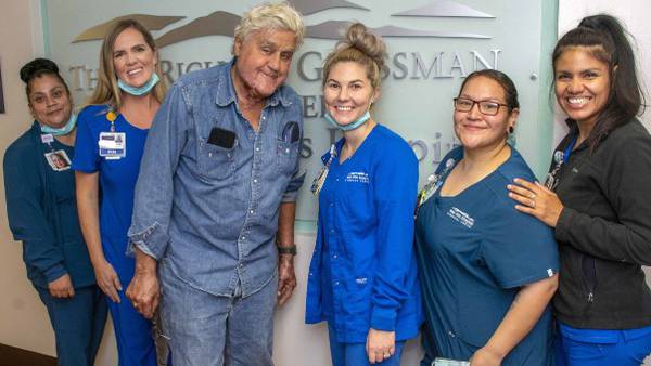 A smiling Jay Leno released from burn center after garage accident