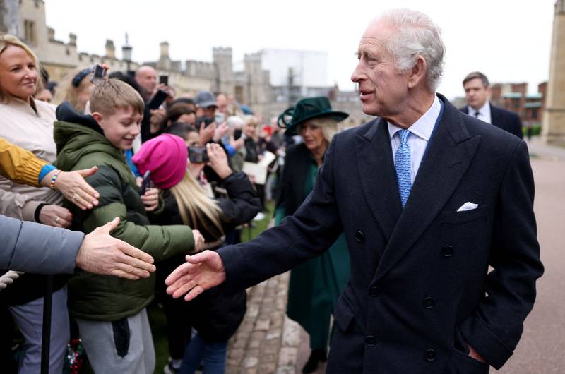 WINDSOR, ENGLAND - MARCH 31: King Charles III and Queen Camilla greet people after attending the Easter Mattins Service at Windsor Castle on March 31, 2024 in Windsor, England. (Photo by Hollie Adams - WPA Pool/Getty Images)