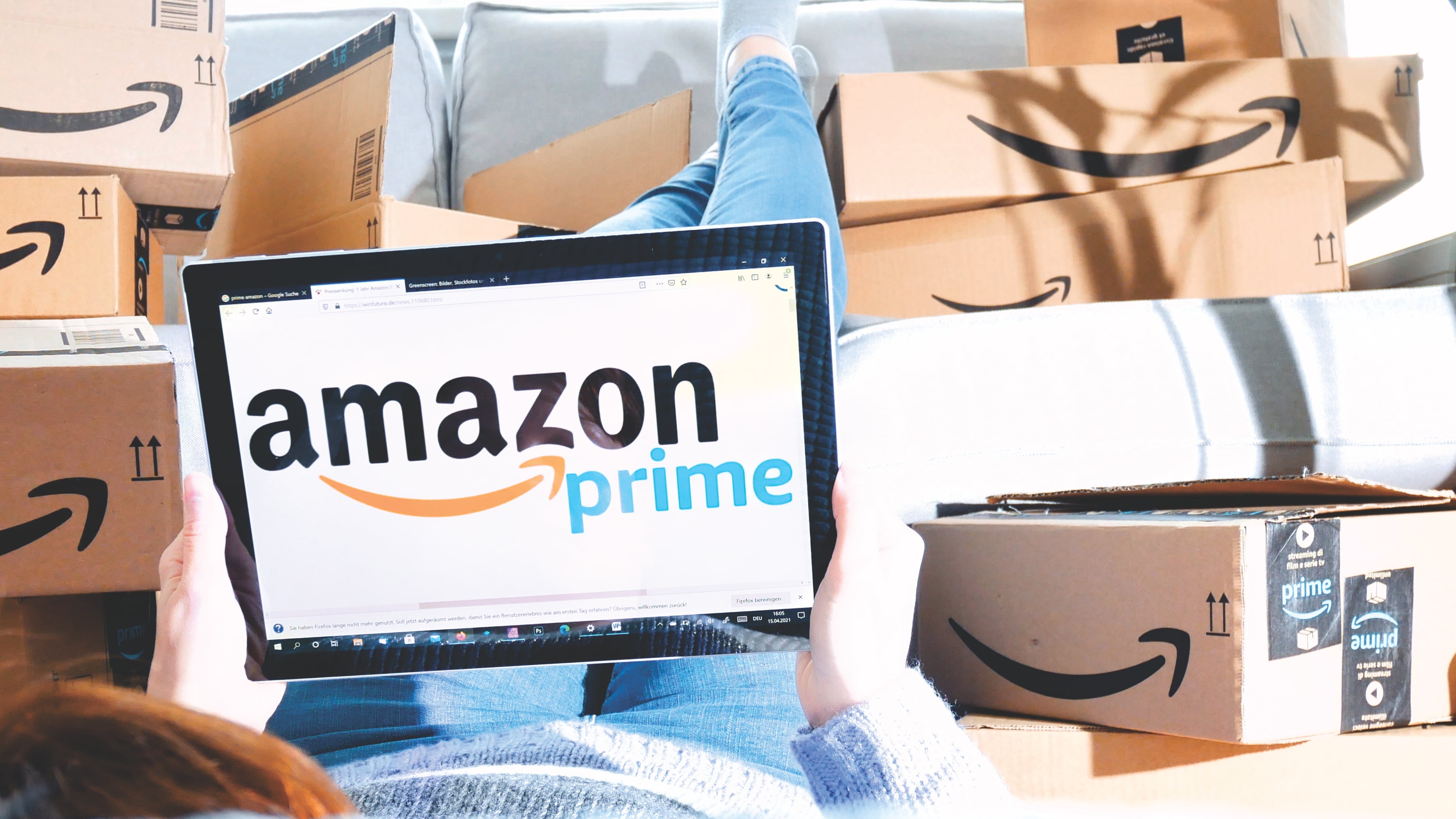 Stack of Amazon Prime packages. woman shopping online at Amazon Prime Day.